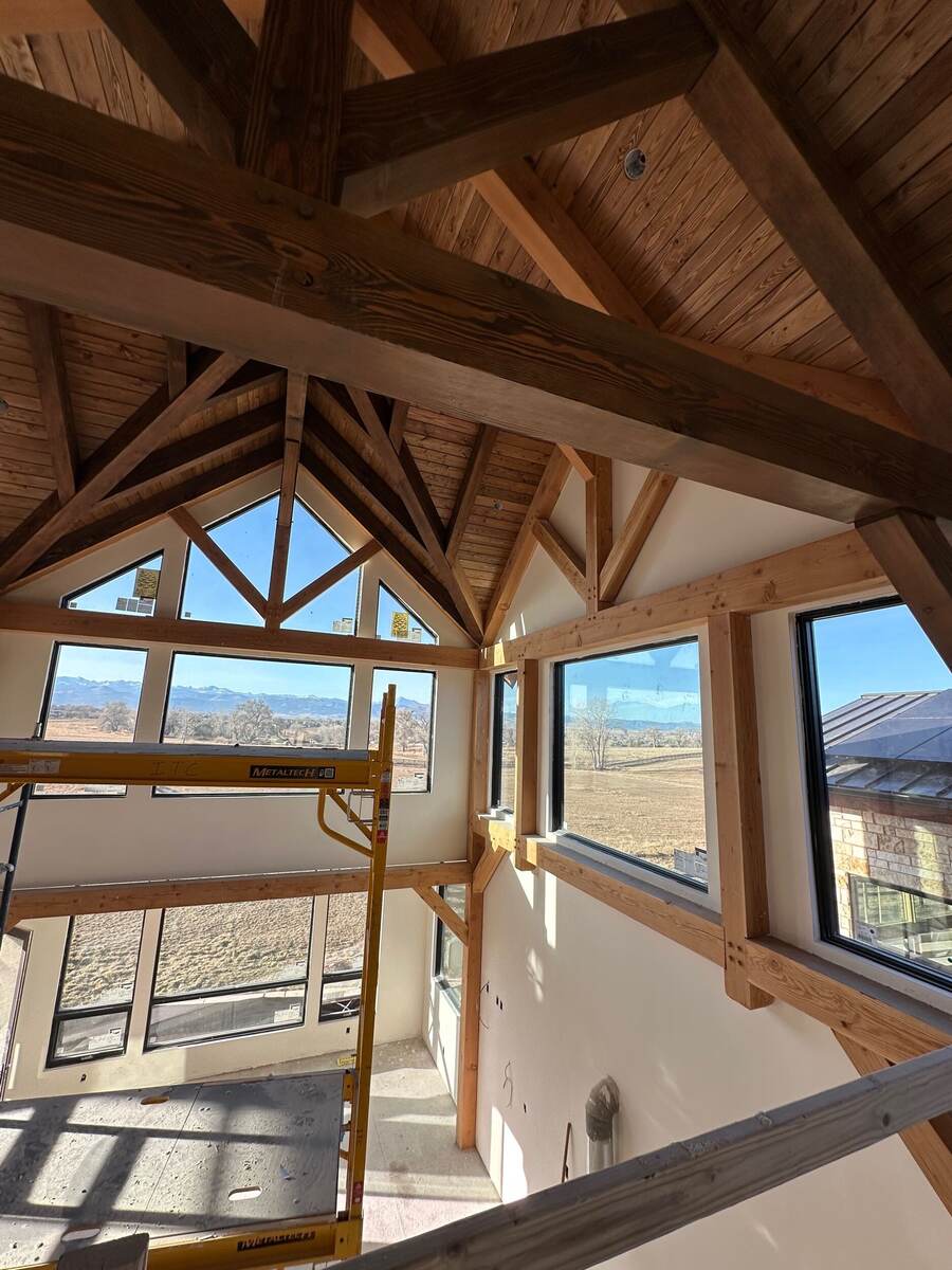 Strong Finish Drywall and Paint — custom stained timber frame trusses and vaulted wood ceiling, Denver Colorado