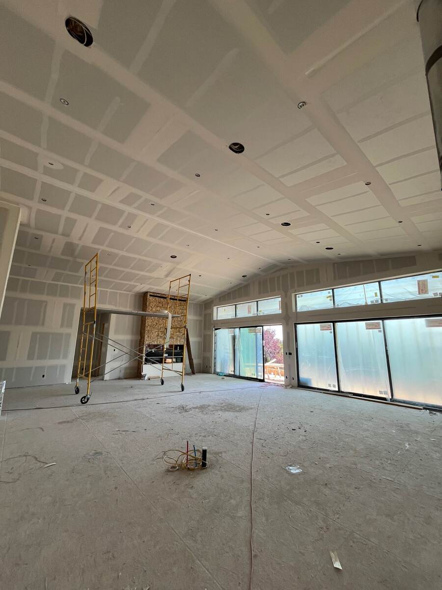 Strong Finish Drywall custom home — vaulted coffered ceiling and wall of windows in a Denver custom build, drywall installation